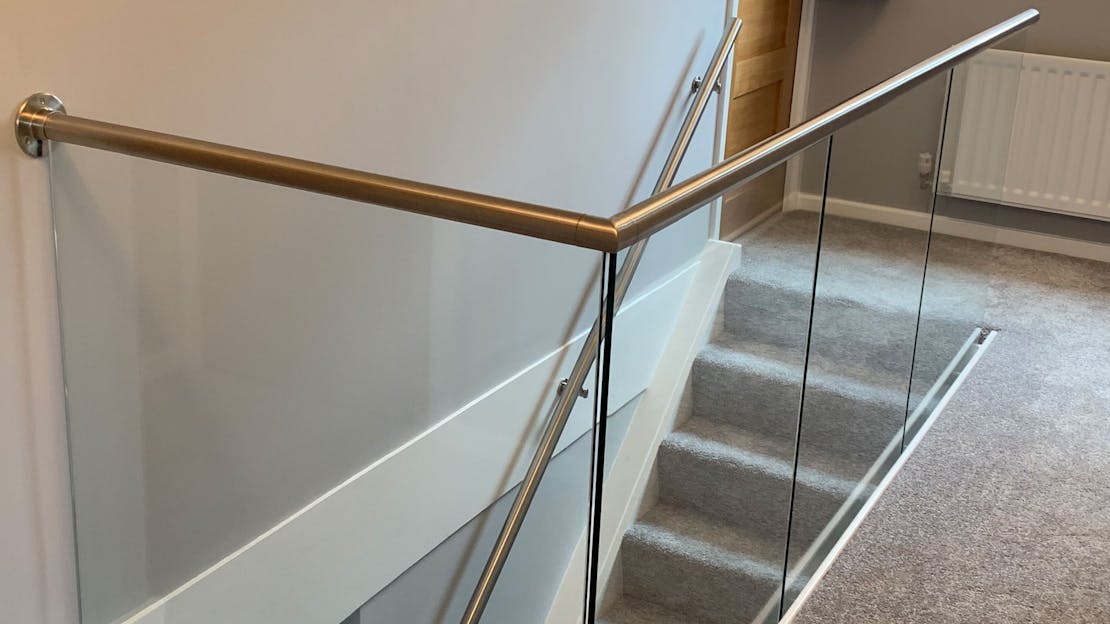 Stainless & glass balustrade install to stairs and landing